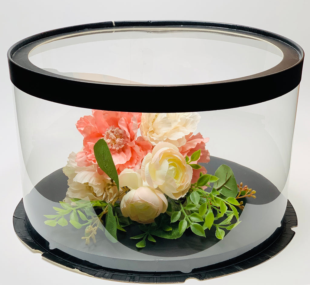 flowers in clear short round cake box