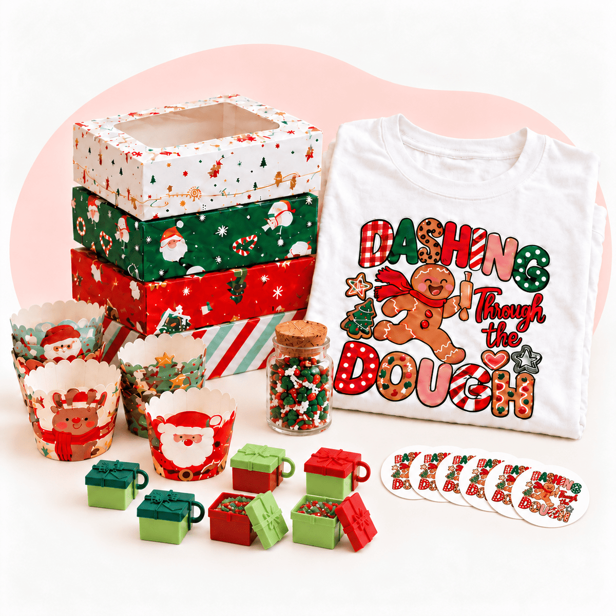 Holly Jolly Baker Box contents: present cake toppers, Christmas cupcake liners, cookie boxes, sprinkles, stickers and Dashing Through the Dough tee
