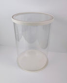 Clear plastic container with a white lid on a white background