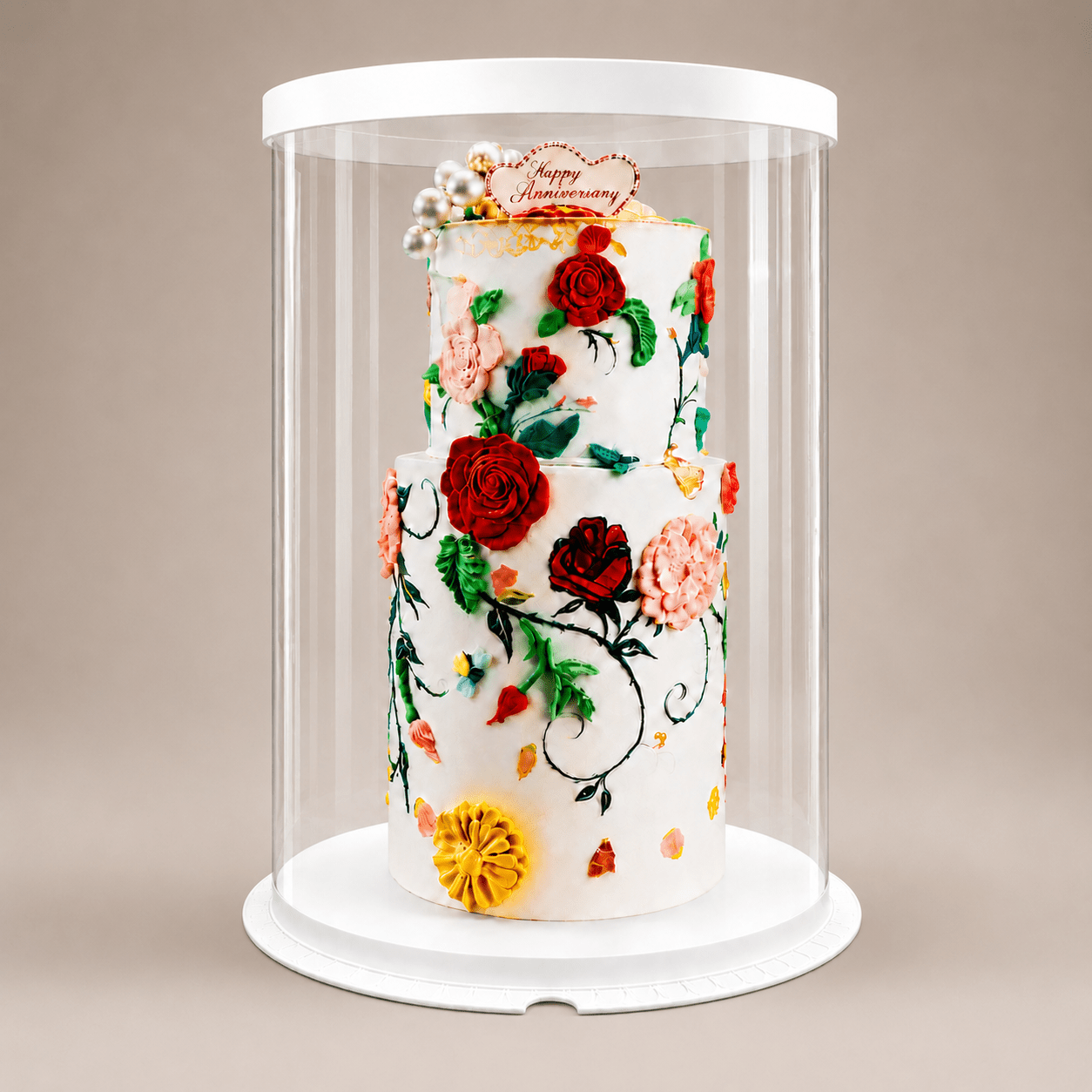 Decorative cake with floral designs in a clear display case on a beige background