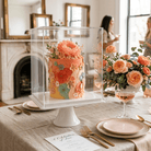 Decorative cake with floral design on a table set for a celebration.